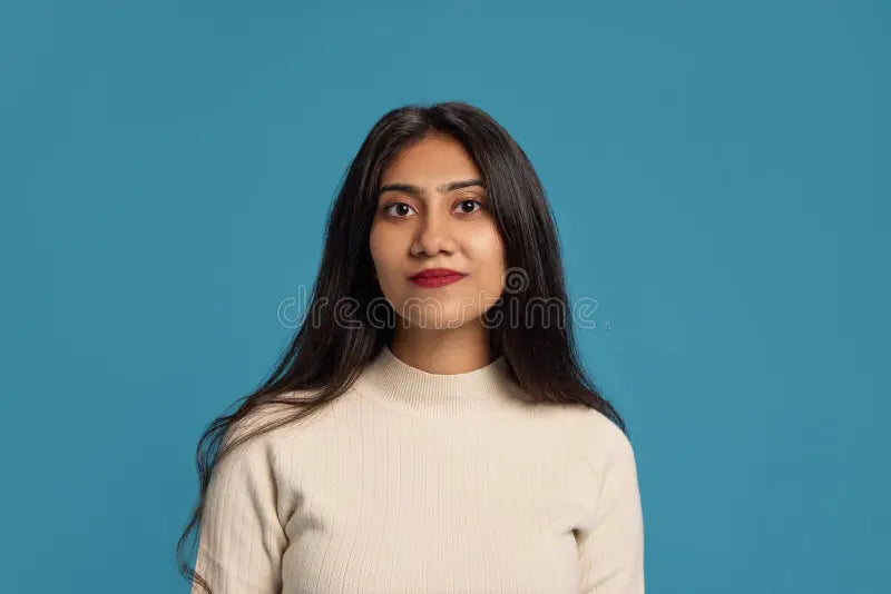 files/portrait-years-old-indian-woman-black-hair-wearing-light-blouse-posing-calm-face-against-blue-studio-portrait-347959960.webp